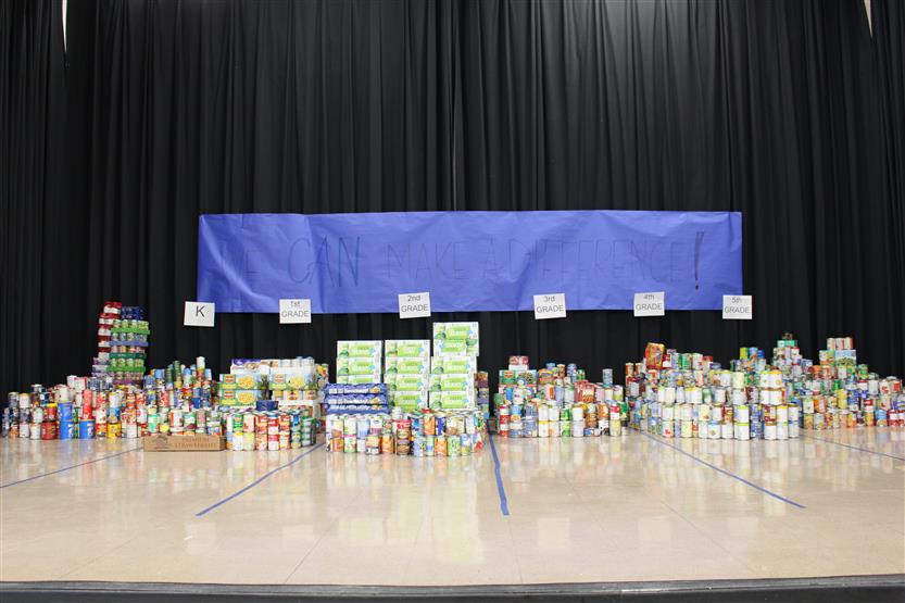 Students collect food for a can drive